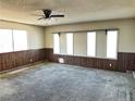 Spacious living room with large windows and wall-to-wall carpeting at 3915 Delling Ct, Las Vegas, NV 89104