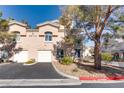 Two-story building with attached garages and landscaping at 3950 S Sandhill Rd # 110, Las Vegas, NV 89121