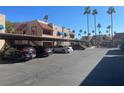 Condo complex parking lot with covered spaces at 4111 Sanderling Cir # 354, Las Vegas, NV 89103