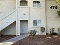 Close up of an apartment exterior showcasing the entrance with pathway and desert landscaping at 4316 W Lake Mead Blvd # 102, Las Vegas, NV 89108