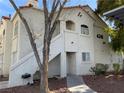 Apartment exterior featuring a sidewalk, outdoor grill, staircase, and covered parking at 4316 W Lake Mead Blvd # 102, Las Vegas, NV 89108