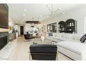 Open living space with white sectional sofa and fireplace at 818 Meyer May St, Las Vegas, NV 89138