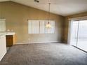 Bright dining area with a window and access to the backyard at 118 Queenswreath Dr, North Las Vegas, NV 89031