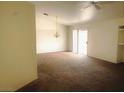 Bright living room with carpeted floors and sliding glass door at 118 Queenswreath Dr, North Las Vegas, NV 89031