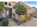 Front entrance with double doors and decorative landscaping at 2261 Boutique Ave, Henderson, NV 89044