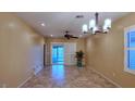 Bright dining room featuring tile floors and a sliding glass door to patio at 2575 Red Planet St, Henderson, NV 89044