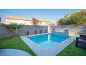 Modern, square-shaped pool with a gray stone surround at 264 Bella Matese Ave, Las Vegas, NV 89183