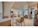 Open concept dining area with modern table and chairs, adjacent to kitchen at 353 E Bonneville Ave # 761, Las Vegas, NV 89101