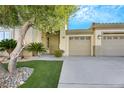 Attractive single-story home with landscaping, a two-car garage, and a welcoming front entrance at 385 Apple River Ct, Las Vegas, NV 89148