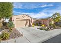 One-story house with a two-car garage and desert landscaping at 4618 Atlantico St, Las Vegas, NV 89135