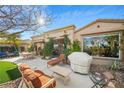 Spacious backyard patio with seating area and built-in grill at 4618 Atlantico St, Las Vegas, NV 89135