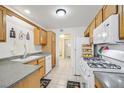 Well-equipped kitchen with wood cabinets and modern appliances at 513 Rafkin Pl, Henderson, NV 89052