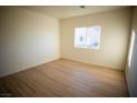 Bright bedroom with light flooring and a large window at 521 Antelope Ave, Pahrump, NV 89060