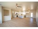 Open-concept living space with recessed lighting, ceiling fan, and wood look flooring at 521 Antelope Ave, Pahrump, NV 89060