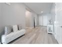 Elegant entryway with a white bench and large mirror at 5260 Brayden Ct, Las Vegas, NV 89131