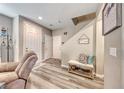 Inviting entryway featuring wood-look floors and a cozy bench with shoe storage at 5428 Brazelton St, North Las Vegas, NV 89081