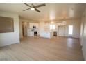 Bright open floor plan with light-colored flooring connecting the living room and kitchen at 5821 Genoa Ave, Pahrump, NV 89060