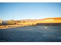 Empty lot with mountain views and gravel ground at 5821 Genoa Ave, Pahrump, NV 89060