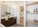 Spa-like bathroom with double vanity, large mirror, and modern fixtures at 602 Calcutta Ln, Henderson, NV 89015