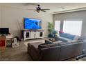 Large living room with sectional sofa and large TV at 6059 Thistle Meadow Ave, Las Vegas, NV 89139