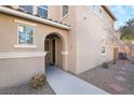 Front entrance with arched entryway and walkway at 6255 W Arby Ave # 218, Las Vegas, NV 89118