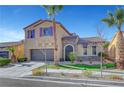 Two-story house with purple shutters, stone accents, and a landscaped yard at 6819 Rolling Boulder St, Las Vegas, NV 89149