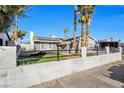 Single-story house with solar panels, a gray exterior, and a small front yard at 7026 Westpark Ct, Las Vegas, NV 89147