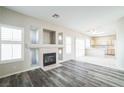 Open concept living and kitchen area with vinyl plank flooring at 7809 Smokerise Ct, Las Vegas, NV 89131