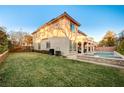 Stunning pool and spa surrounded by a grassy lawn at 8593 Garden Valley Ct, Las Vegas, NV 89178