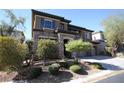 House exterior, stone and stucco with landscaping at 8719 Mount Mira Loma Ave, Las Vegas, NV 89178