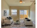 Bright living room with access to a balcony at 8777 W Maule Ave # 2109, Las Vegas, NV 89148