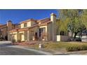 Two-story house with tan exterior, tile roof, and two-car garage at 8916 Stafford Springs Dr, Las Vegas, NV 89134