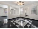 Bright living room with a geometric tile floor and high ceilings at 9523 Cherrydale Ct, Las Vegas, NV 89147