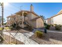 Condo building showcasing stairs and landscaping at 1005 Sulphur Springs Ln # 202, Las Vegas, NV 89128