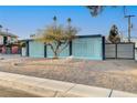 Midcentury modern home with a unique blue block wall facade at 1558 Aztec Way, Las Vegas, NV 89169