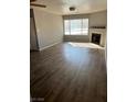 Spacious living room with wood-look floors and large windows at 2072 Mesquite Ln # 104, Laughlin, NV 89029