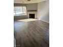 Bright living room featuring a fireplace and wood-look floors at 2072 Mesquite Ln # 104, Laughlin, NV 89029