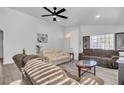 Relaxing living room with hardwood floors and large windows at 2419 Country Valley Ct, North Las Vegas, NV 89030