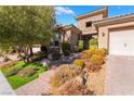 Inviting front entrance with landscaping and stone accents at 2837 Josephine Dr, Henderson, NV 89044