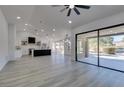 Open concept kitchen with island, stainless steel appliances, and white cabinets at 2905 Legend Dr, Las Vegas, NV 89134