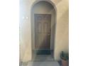 Exterior entry door with arched entryway, number 203 at 3810 Wiggins Bay St # 203, Las Vegas, NV 89129