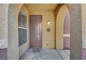 Inviting entryway with brown door and welcome mat at 3975 N Hualapai Way # 157, Las Vegas, NV 89129