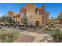 Tan and brown building with walkway and landscaping at 3975 N Hualapai Way # 157, Las Vegas, NV 89129