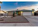 Ranch style home with landscaped yard and attached garage at 4475 El Carnal Way, Las Vegas, NV 89121