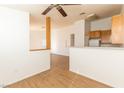 Kitchen with light wood cabinets, laminate floors, and appliances at 4730 E Craig Rd # 2028, Las Vegas, NV 89115