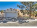 Charming single-story home featuring a well-maintained front yard, a two-car garage, and a beautiful terracotta roof at 5624 Silver Belle St, Las Vegas, NV 89149