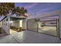 Modern entryway with custom gate and walkway at 5750 Edna Ave, Las Vegas, NV 89146