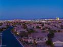 Expansive cityscape view from a residential area, capturing the vibrant city lights and skyline at 6289 Redstone Hills Dr, Las Vegas, NV 89148