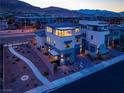 Contemporary two-story home with a stylish design and balcony, enhanced by desert landscaping at 6289 Redstone Hills Dr, Las Vegas, NV 89148