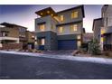 Contemporary home with a two-car garage and landscaped yard at 6289 Redstone Hills Dr, Las Vegas, NV 89148